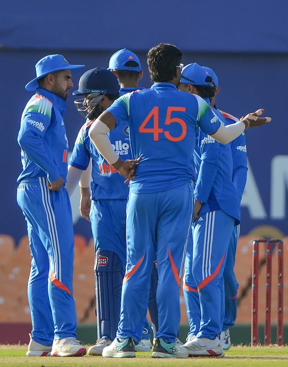 Anukul Roy celebrates a wicket with his team-mates