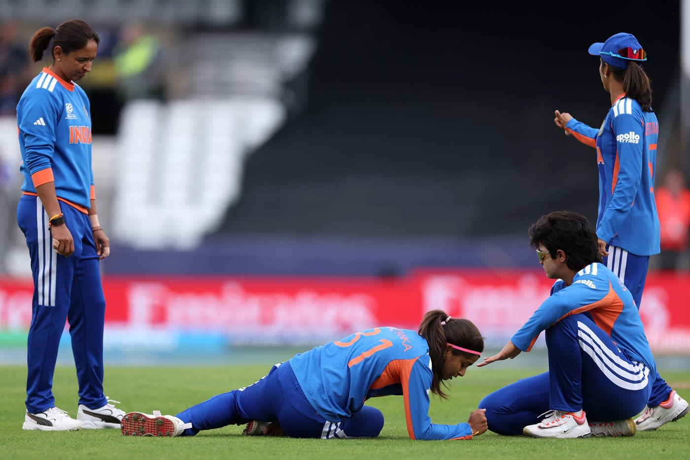 Shreyanka Patil was stretchered off the field after she twisted her right ankle