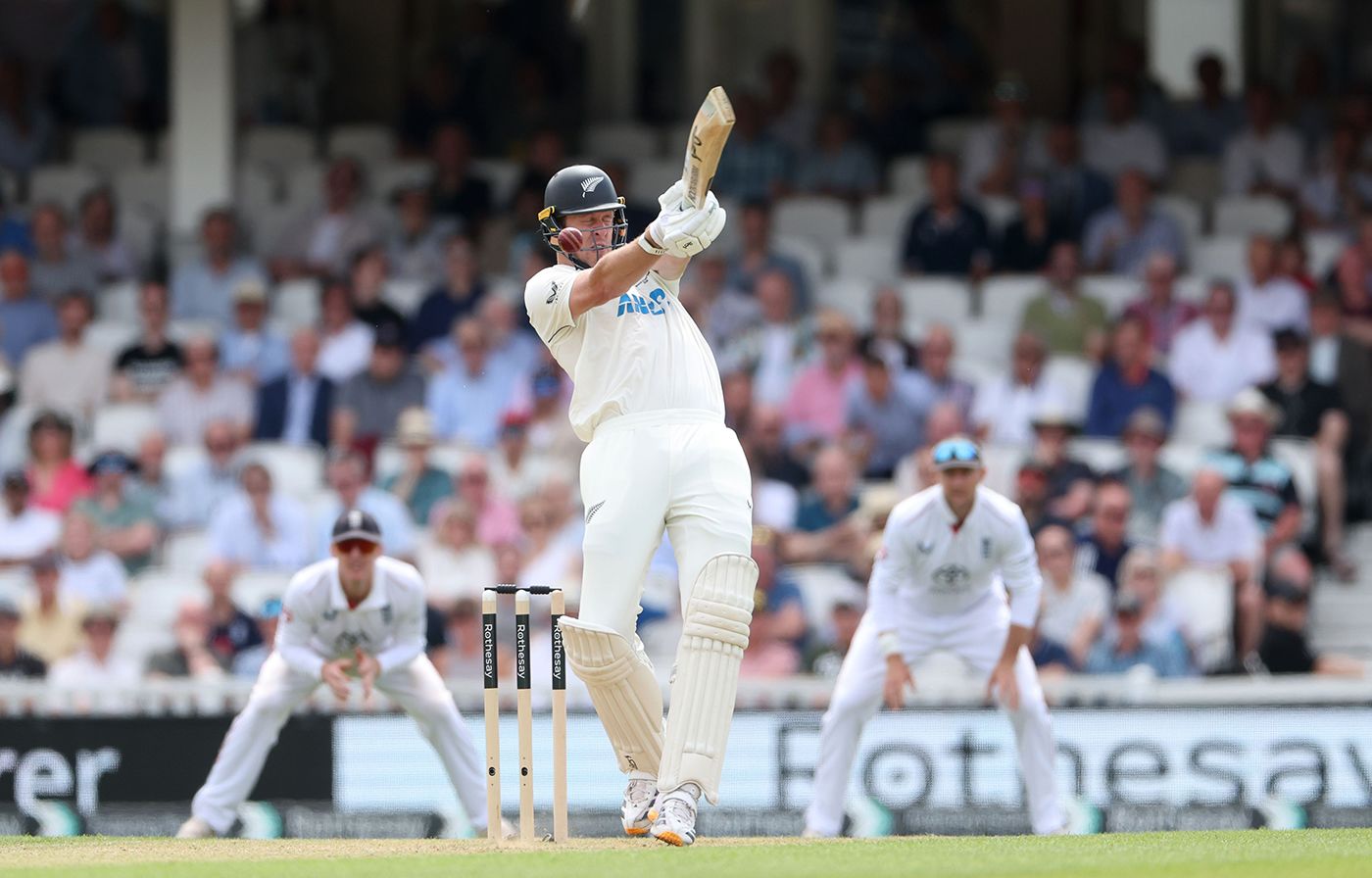 Kyle Jamieson takes a blow from a short ball