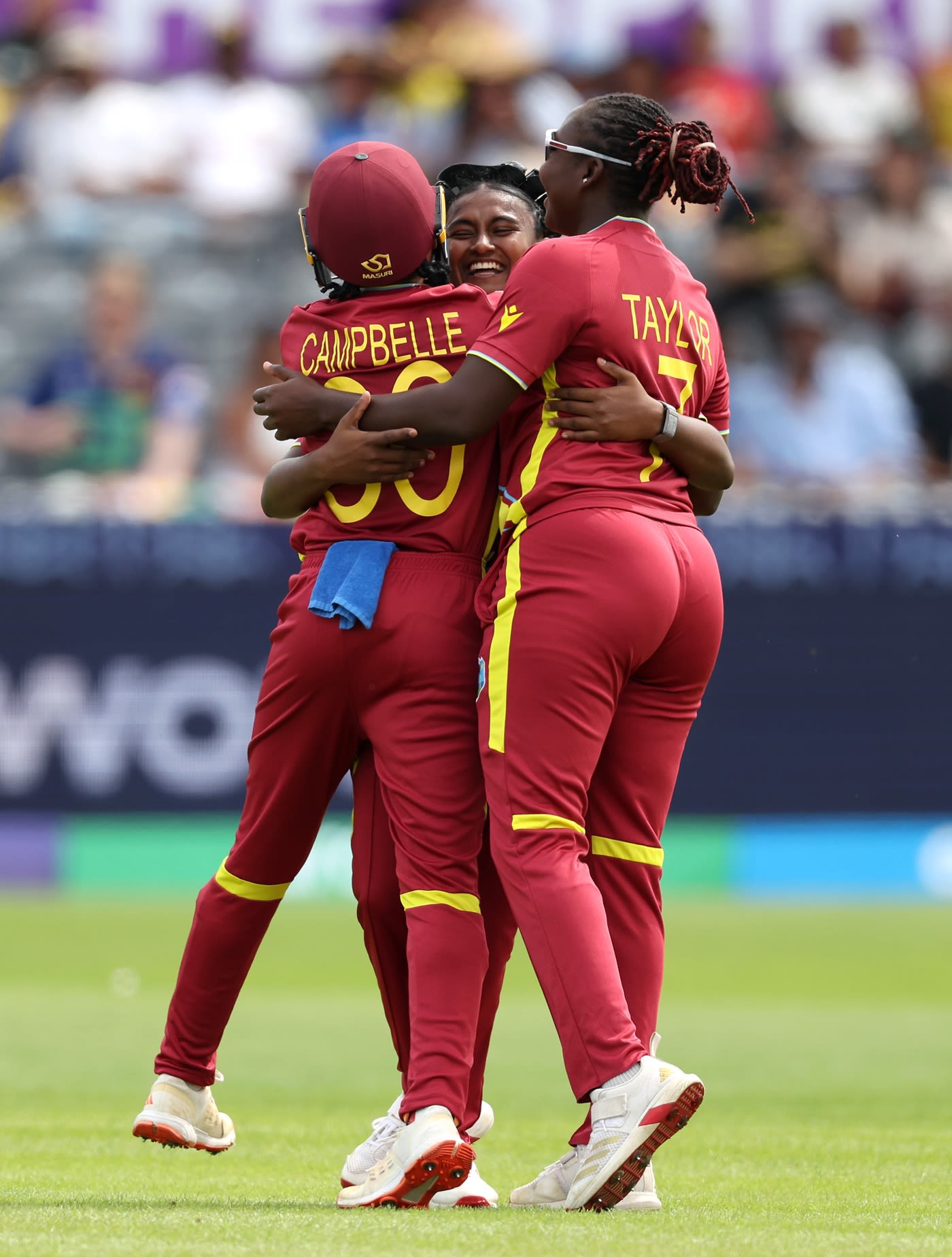 Ashmini Munisar is mobbed by Shemaine Campbelle and Stafanie Taylor after taking a wicket