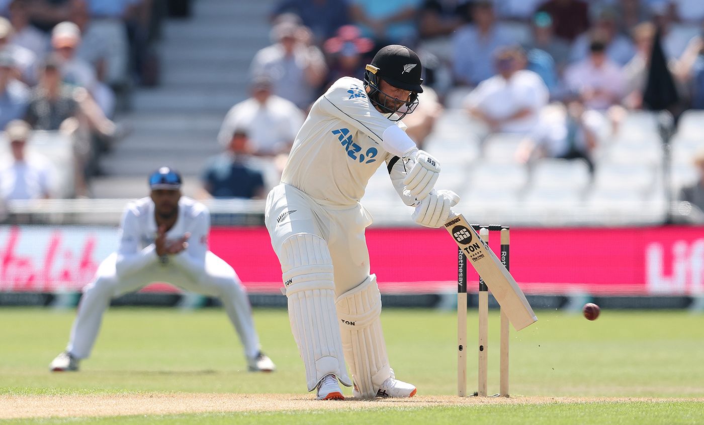 Devon Conway stretches into a drive