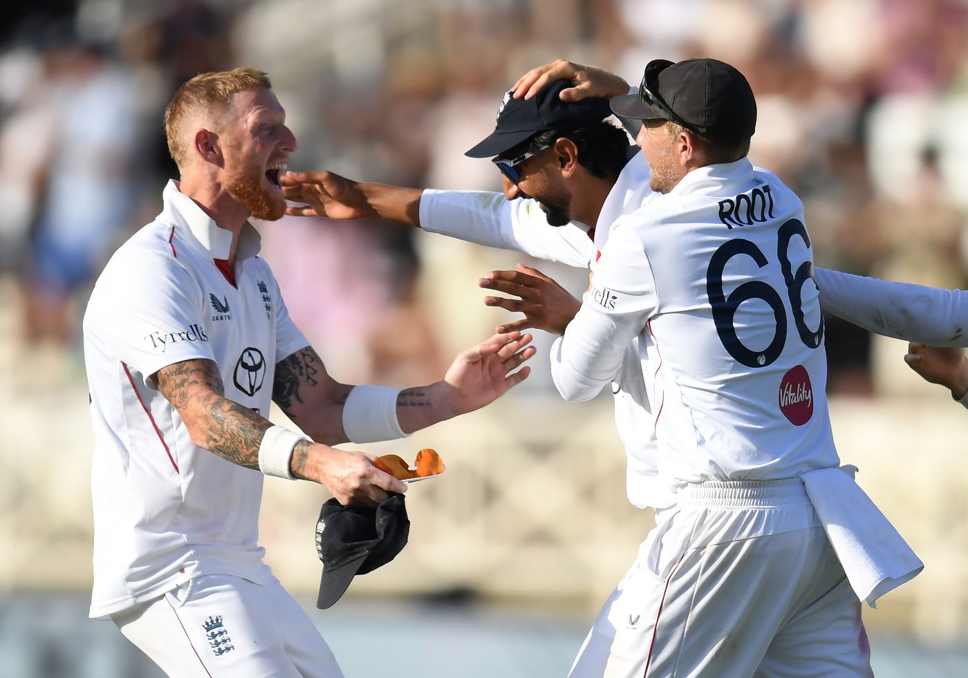 Ben Stokes and Joe Root celebrate with Shoaib Bashir after Rachin Ravindra's wicket