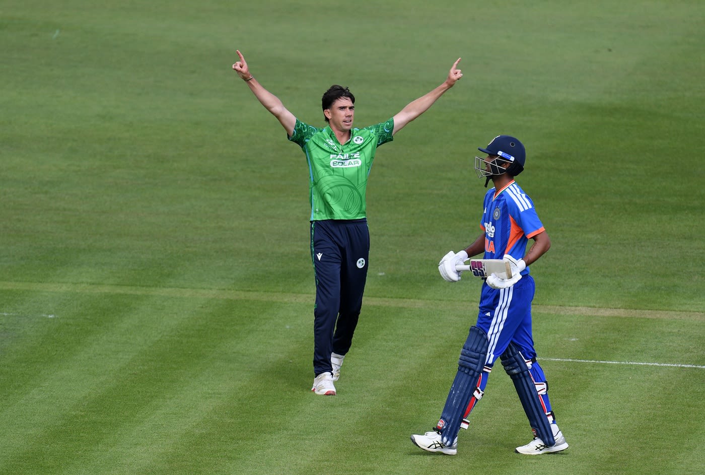 Matt Hollard celebrates after dismissing Washington Sundar