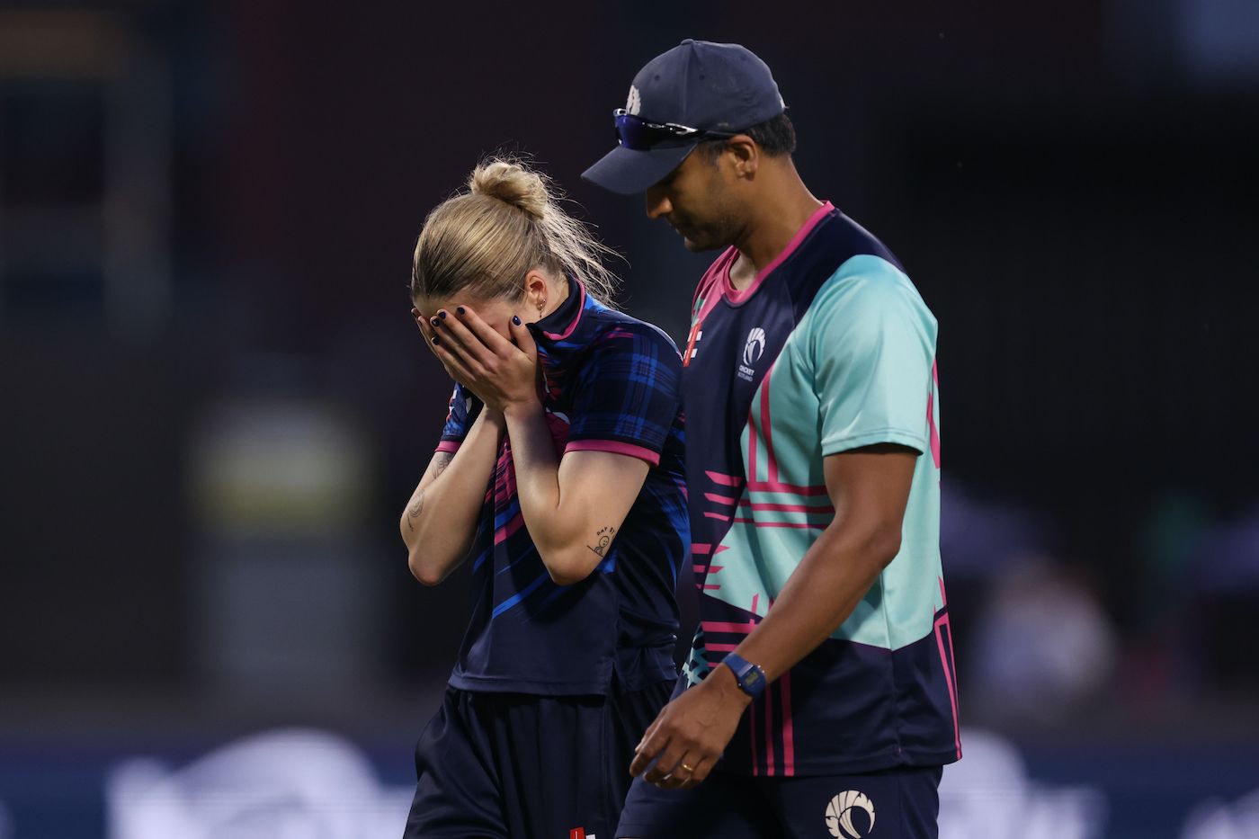 A dejected Rachel Slater walks back after an injury cut short her final over