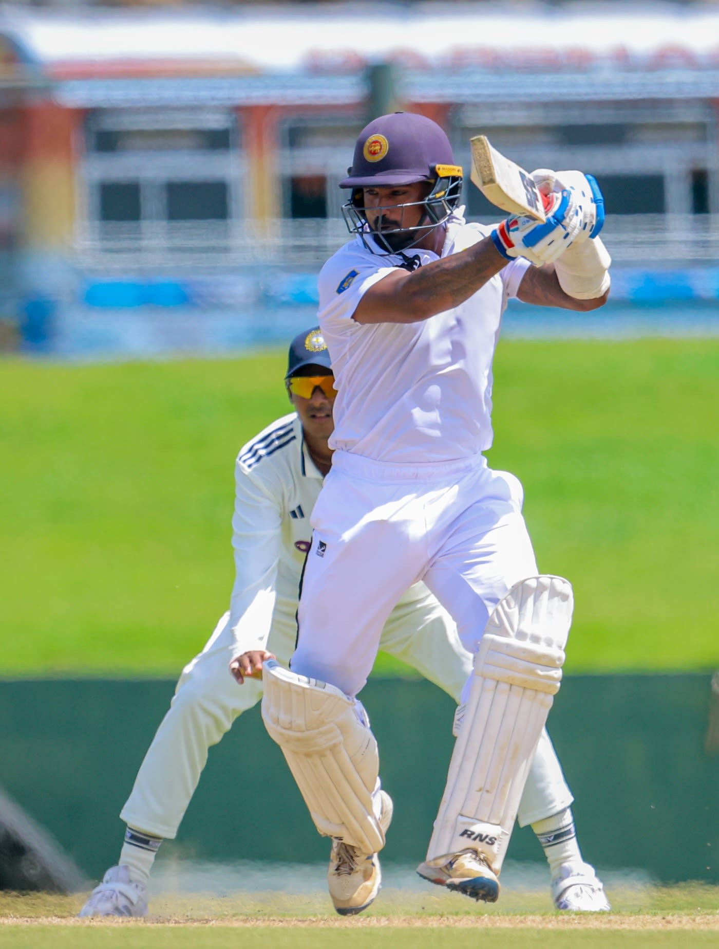 Ashen Bandara punches the ball away