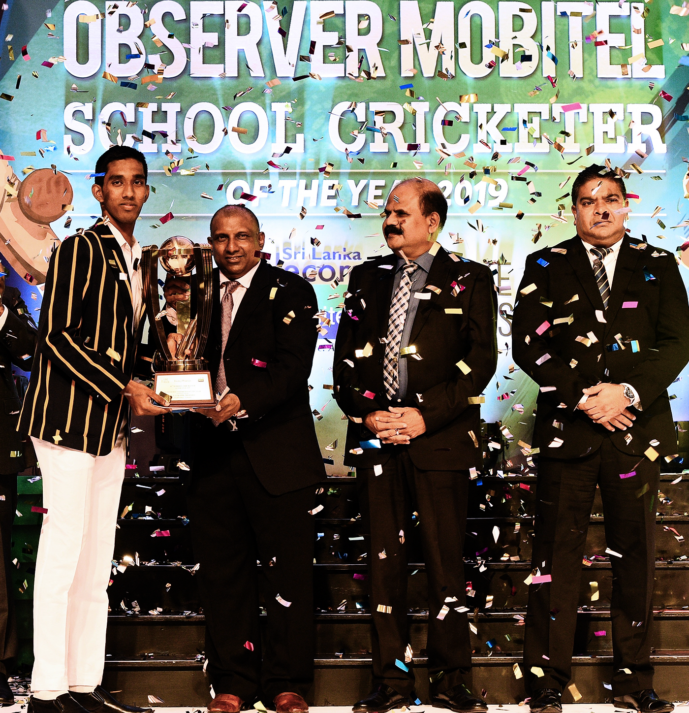 Aravinda de Silva (second from left) hands the Schoolboy Cricketer of the Year award to Kamil Mishara