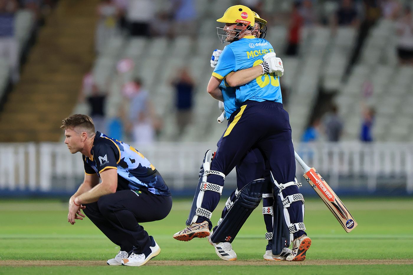 Dan Mousley celebrates hitting the winning runs