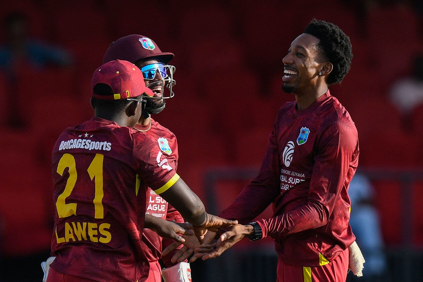 Khary Pierre (right) picked up the wicket of Tom Latham