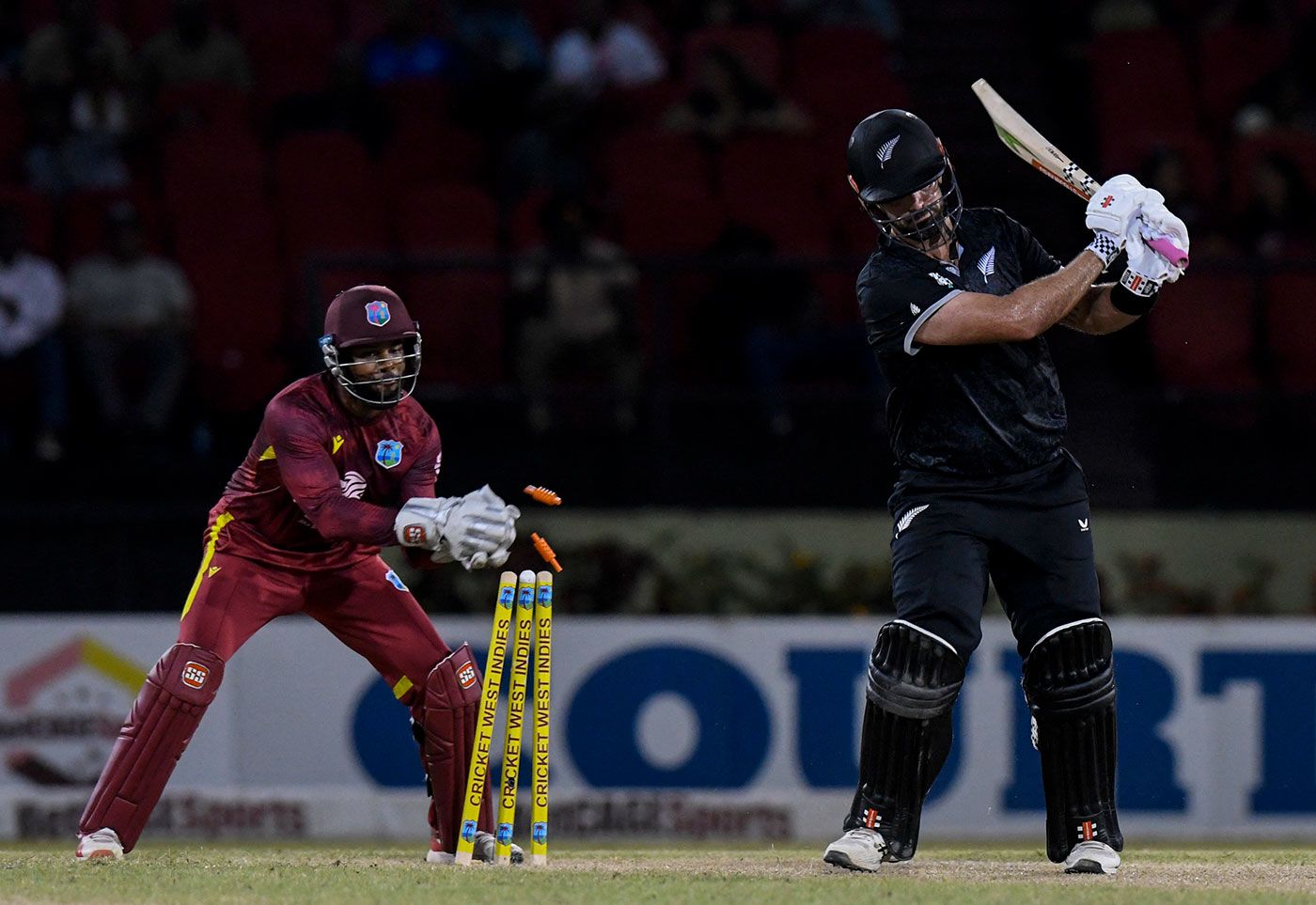 Shai Hope completes the stumping to remove Daryl Mitchell