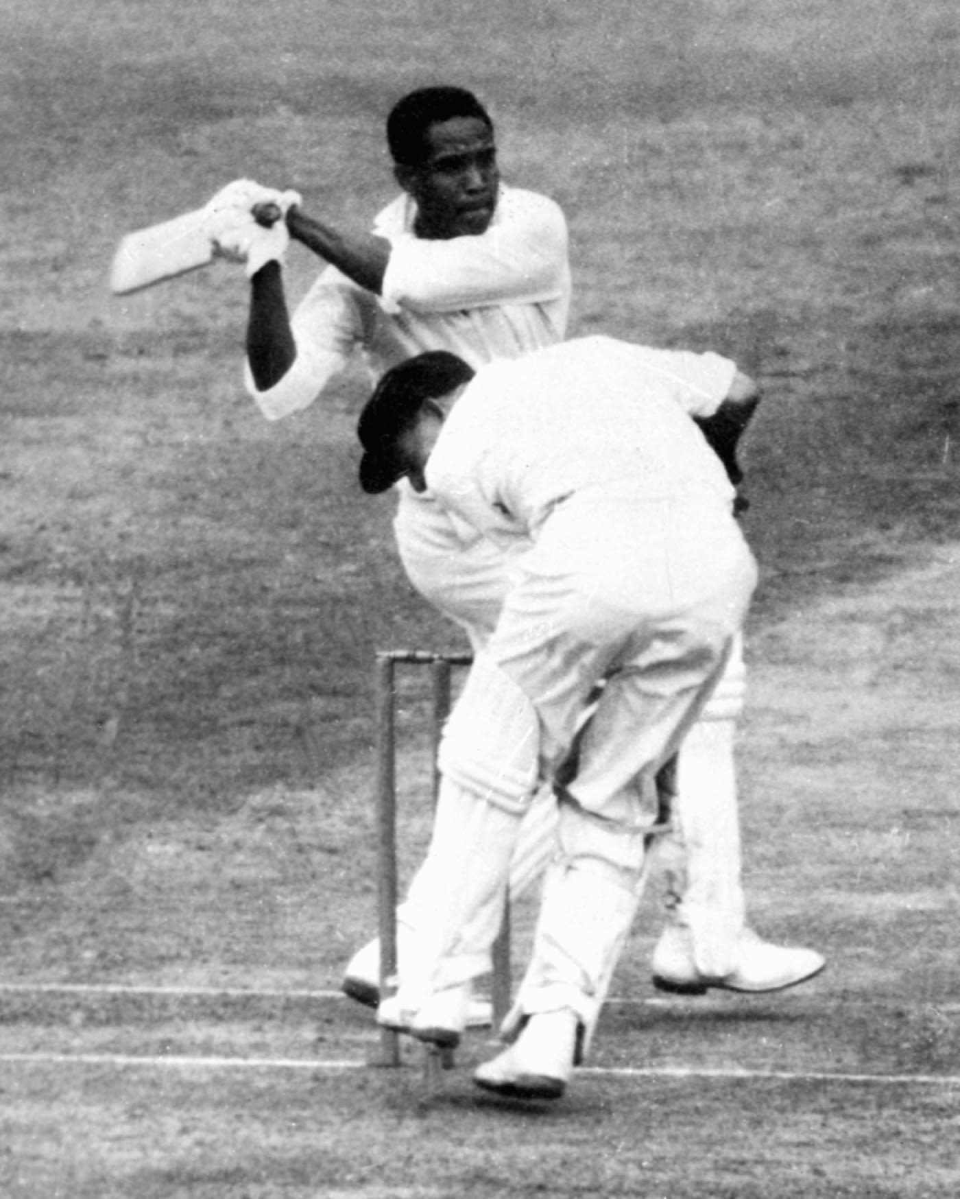 Garry Sobers hooks one past a ducking Wally Grout