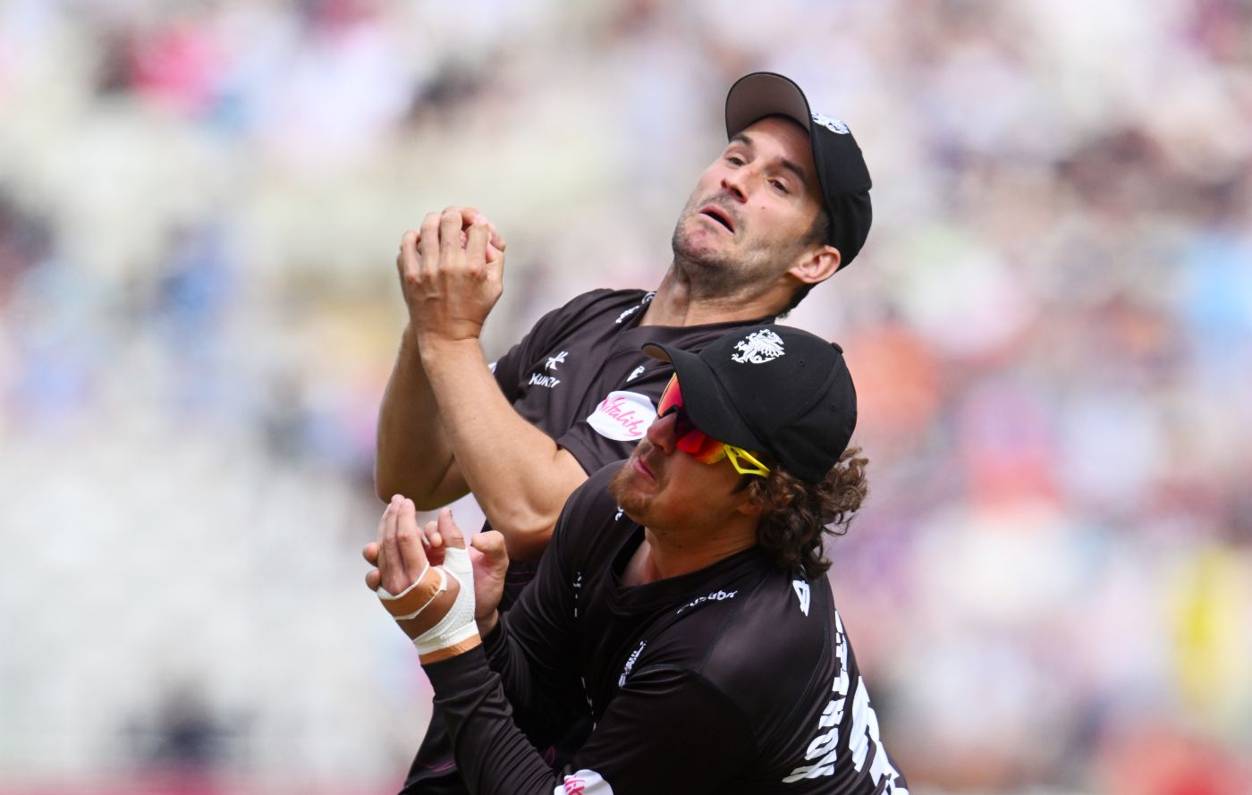 Lewis Gregory collides with Tom Kohler-Cadmore while taking a catch off David Willey