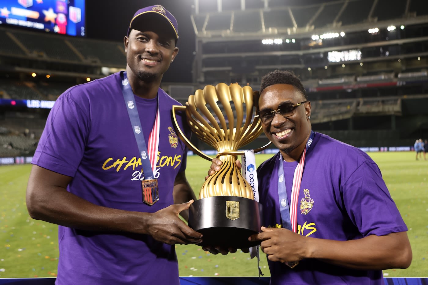 Jason Holder and Dwayne Bravo pose with the trophy