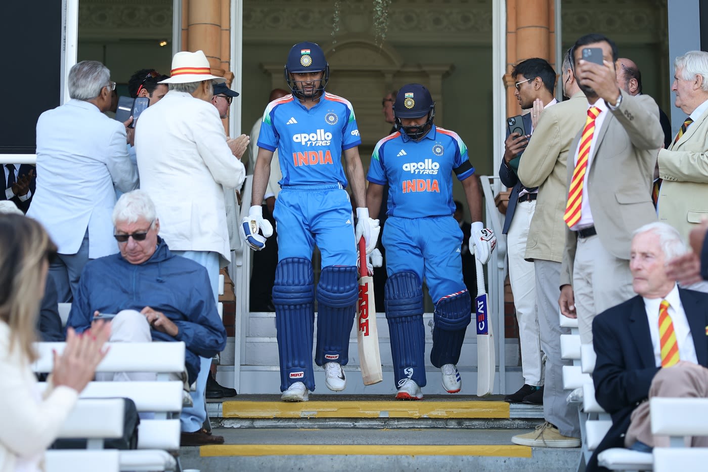 Shubman Gill and Rohit Sharma walk out to open