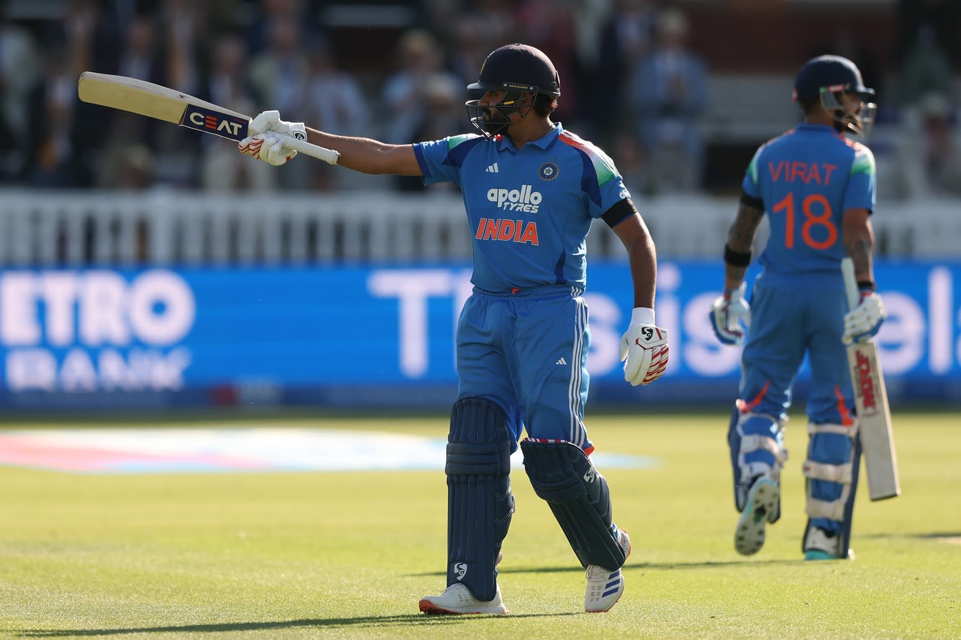 Rohit Sharma celebrates after scoring a century