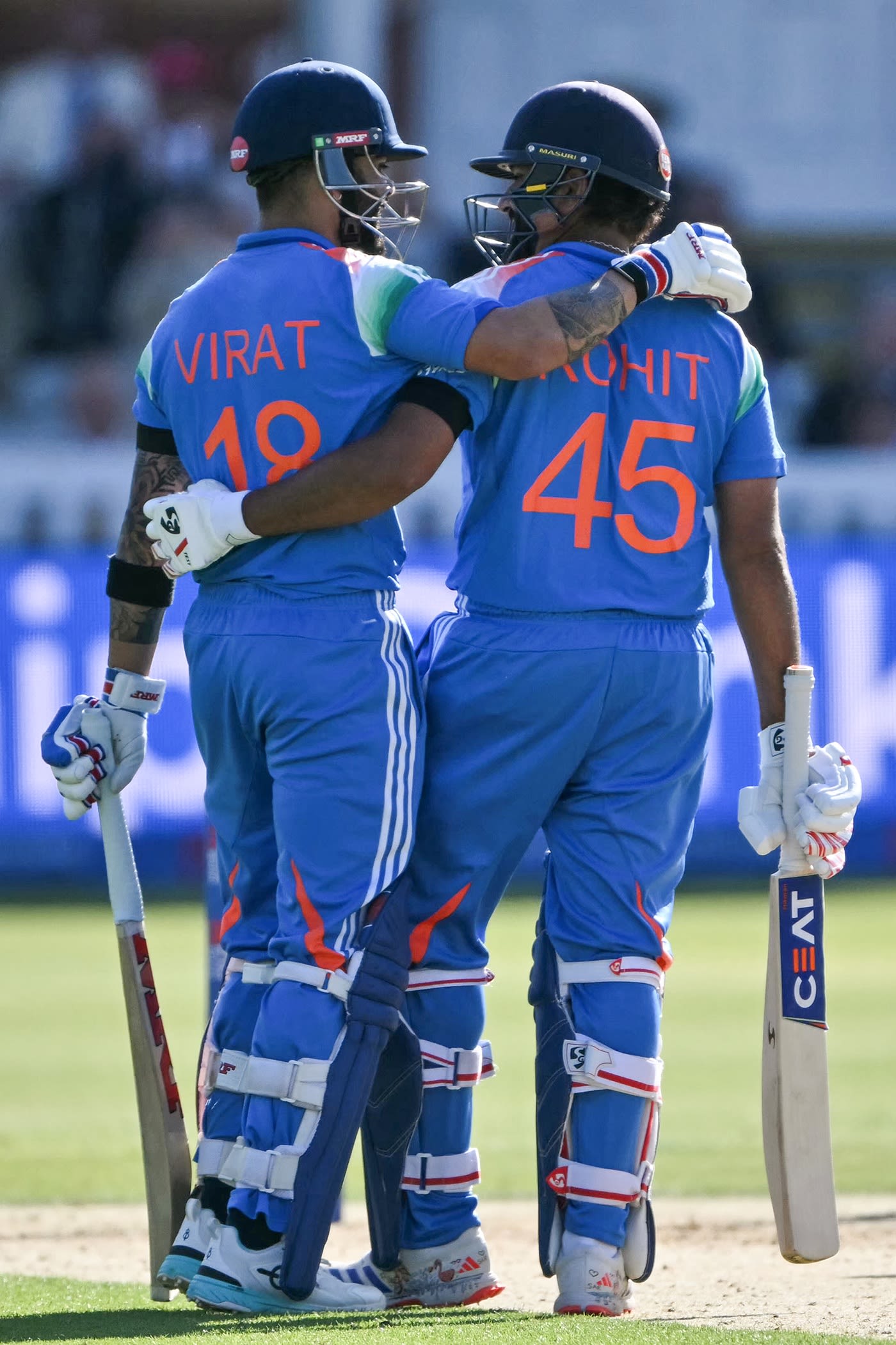 Virat Kohli congratulates Rohit Sharma on his hundred