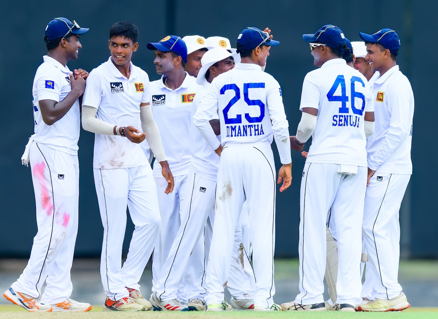 Gimhan Mendis celebrates a wicket with his team-mates