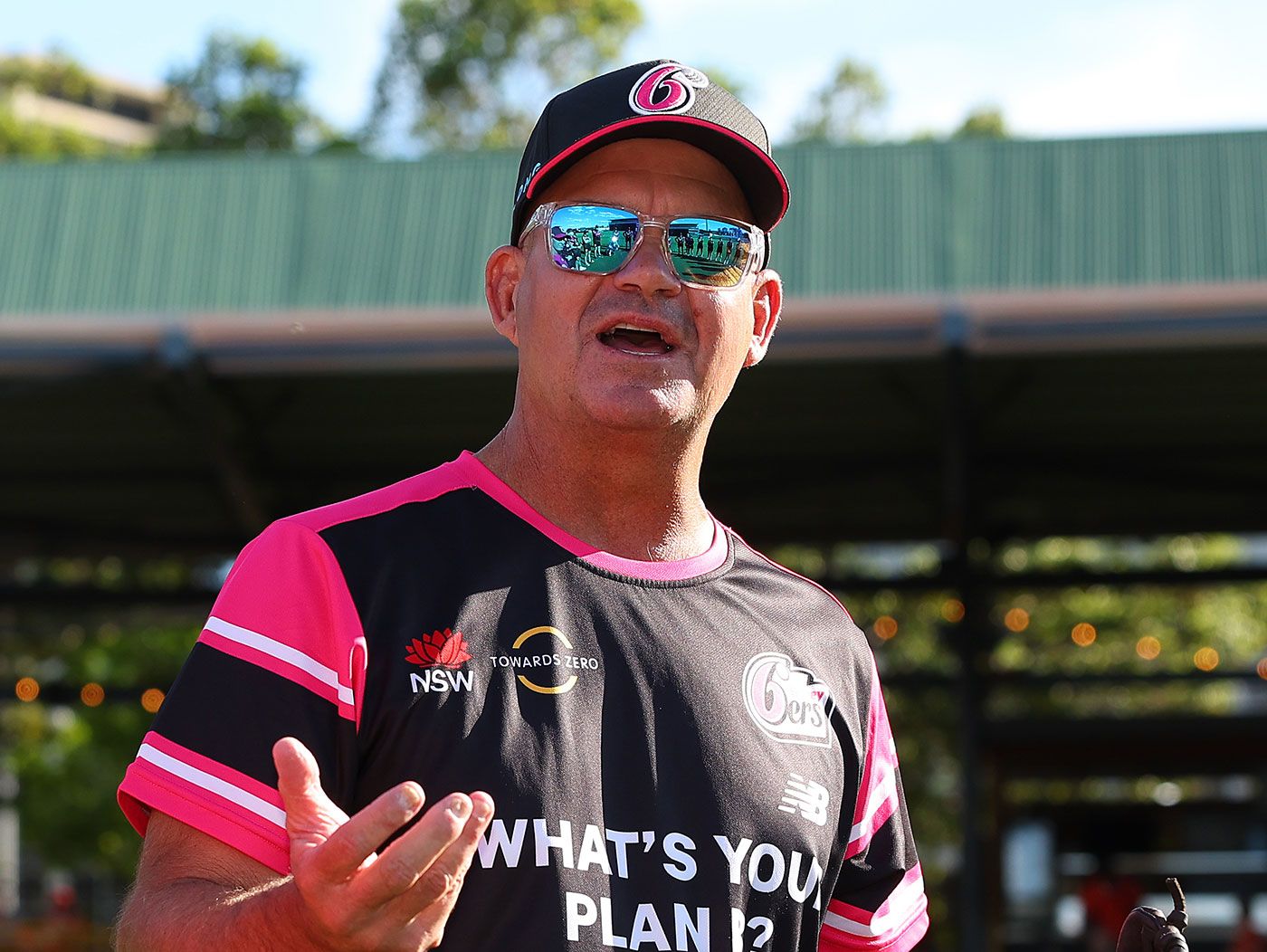 Matthew Mott talks to his team