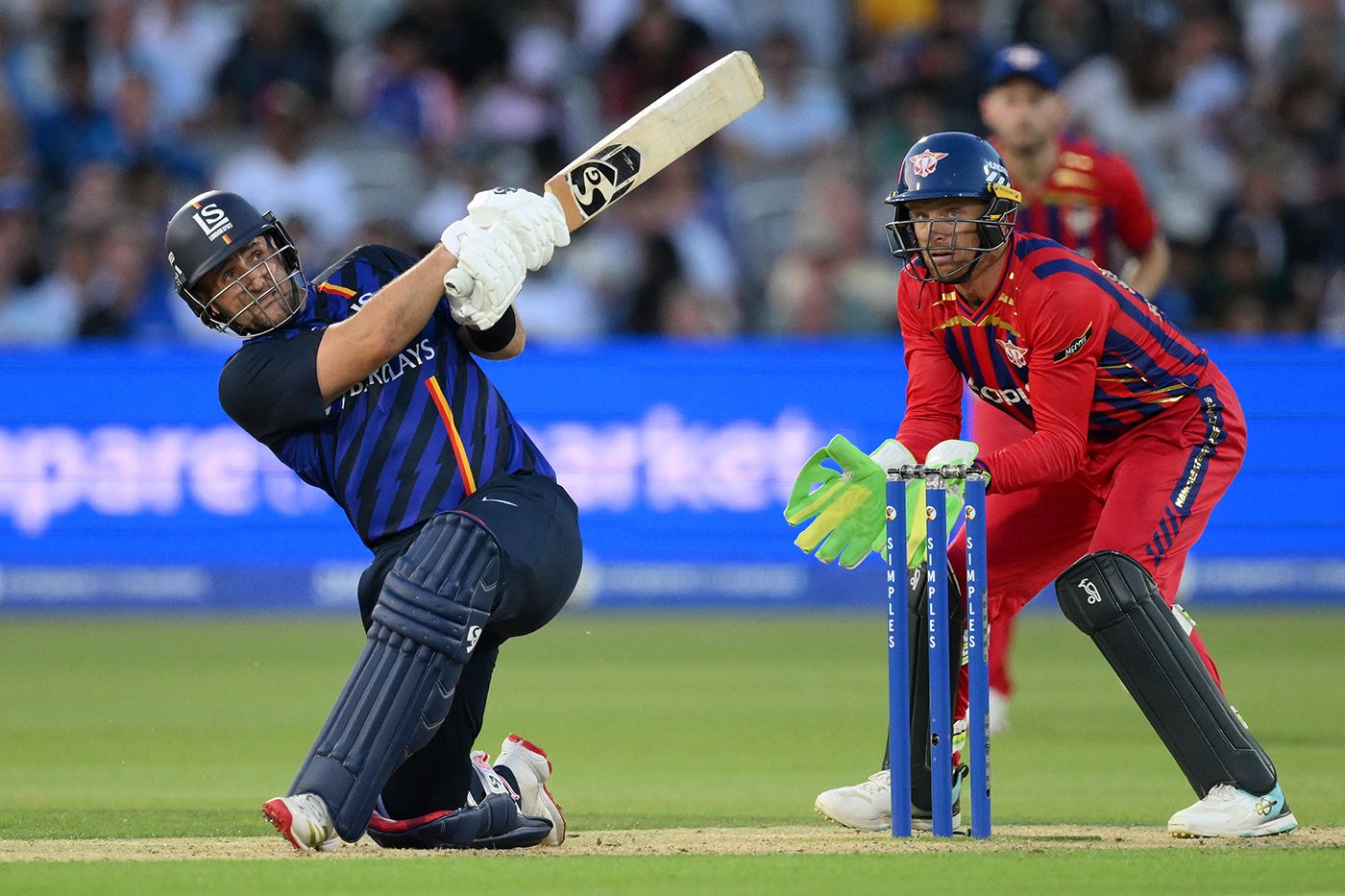 Liam Livingstone gets low to slog-sweep