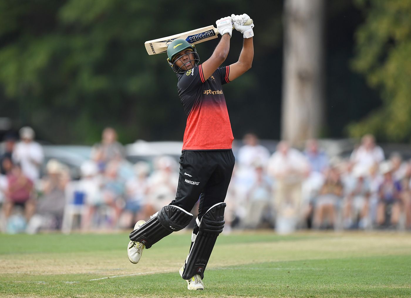 Rishi Patel celebrates his hundred