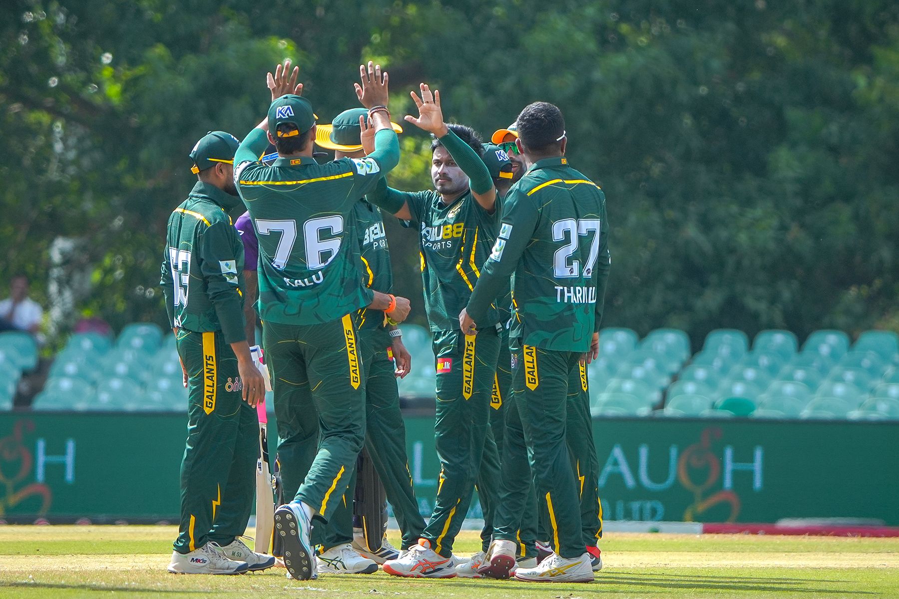 Pramod Madushan celebrates with his team-mates