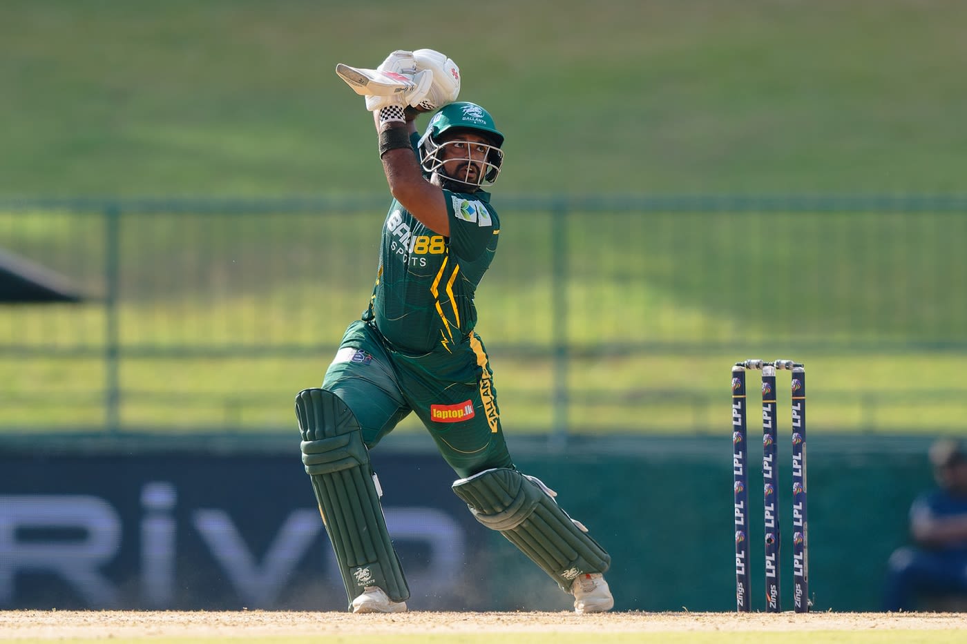Chamika Karunaratne drives on the off side