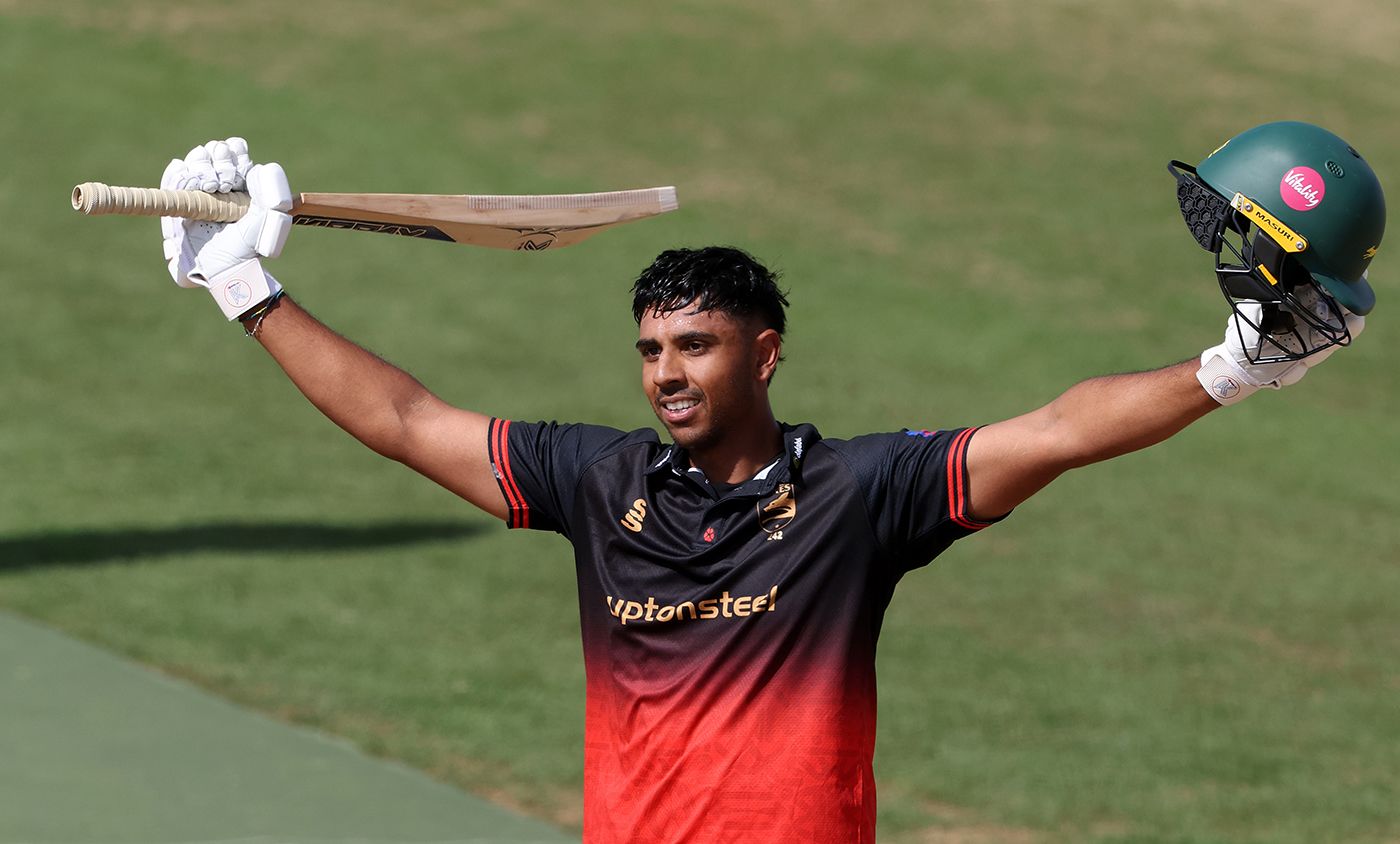 Rishi Patel celebrates reaching his hundred