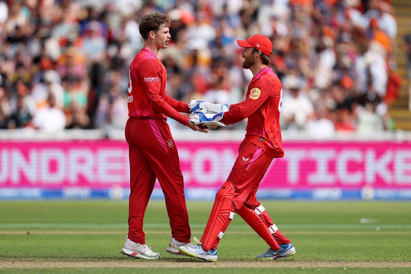 Lockie Ferguson celebrates with Phil Salt
