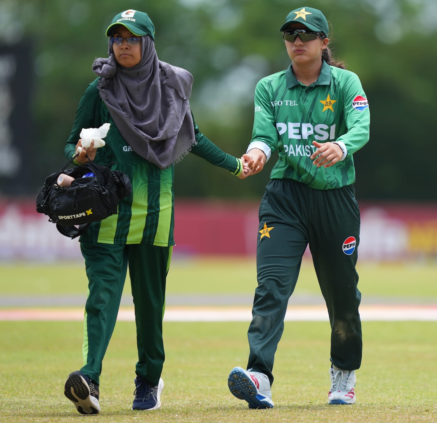 Eman Naseer had to leave the field after picking up an injury