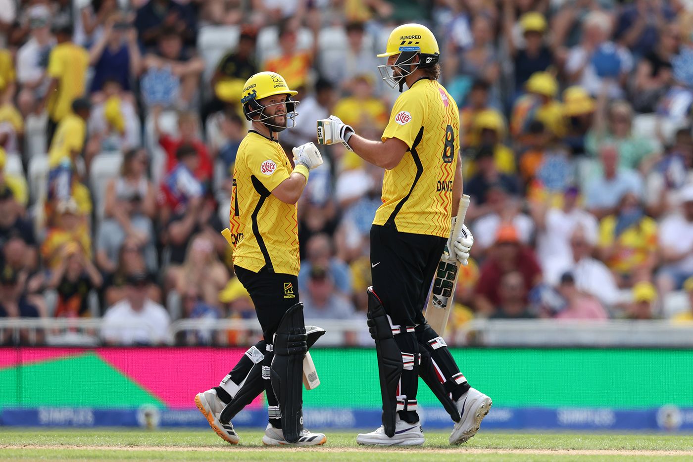 Ben Duckett and Tim David punch gloves