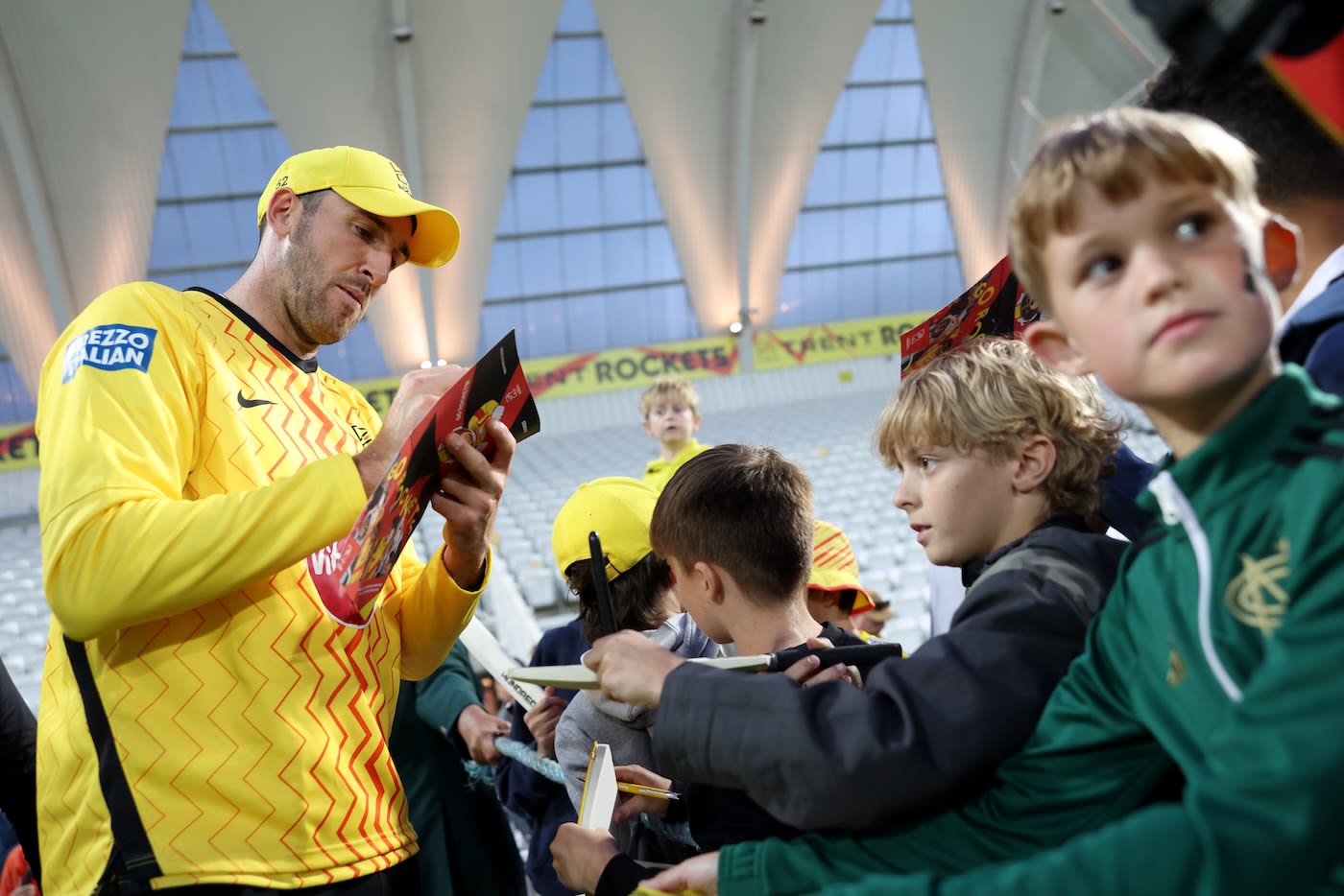 Craig Overton signs an autograph