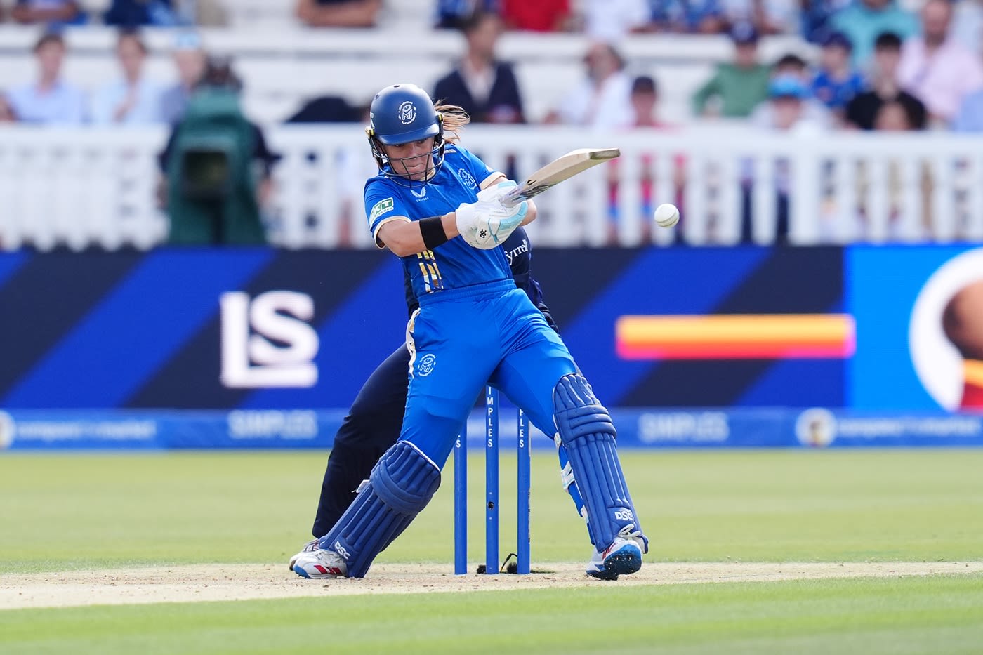 Melie Kerr drags the ball into the leg side