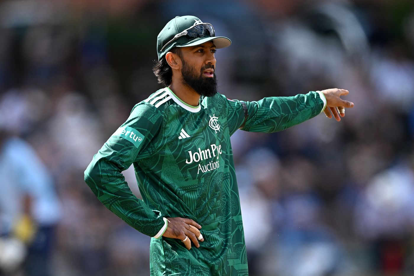 Haseeb Hameed directs his players in the field