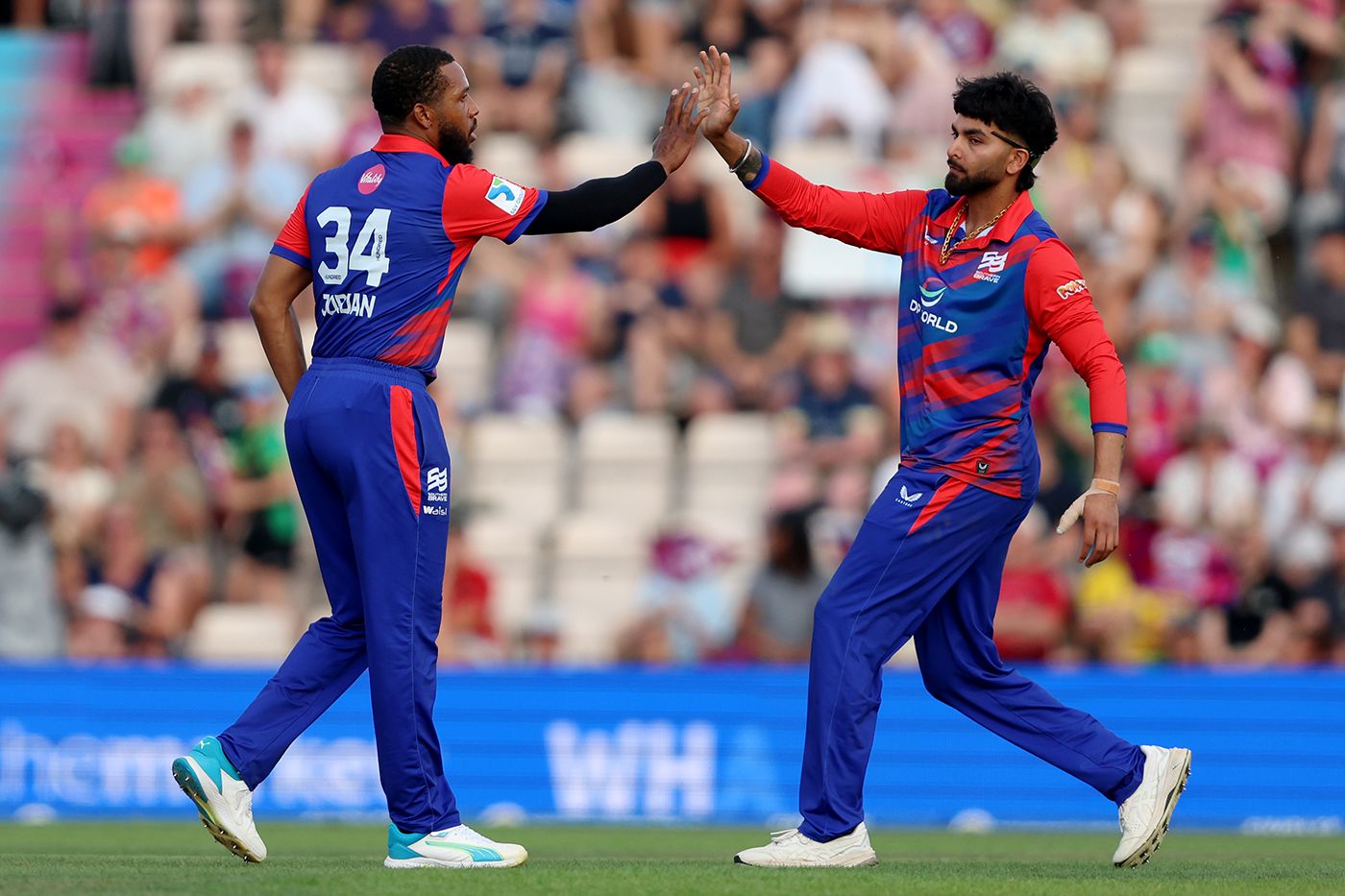 Chris Jordan celebrates taking the wicket of Jos Buttler