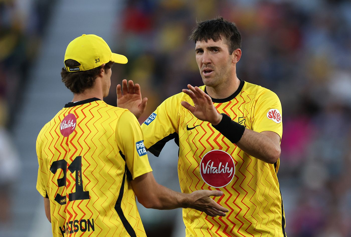 Craig Overton celebrates with Calvin Harrison
