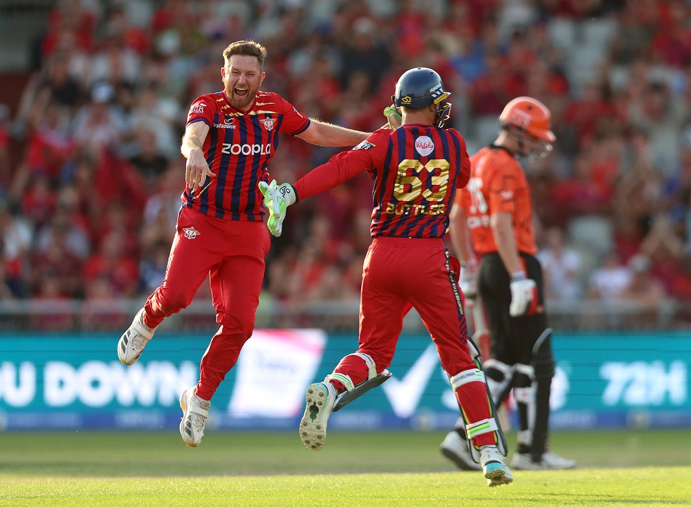 Liam Dawson celebrates with Jos Buttler