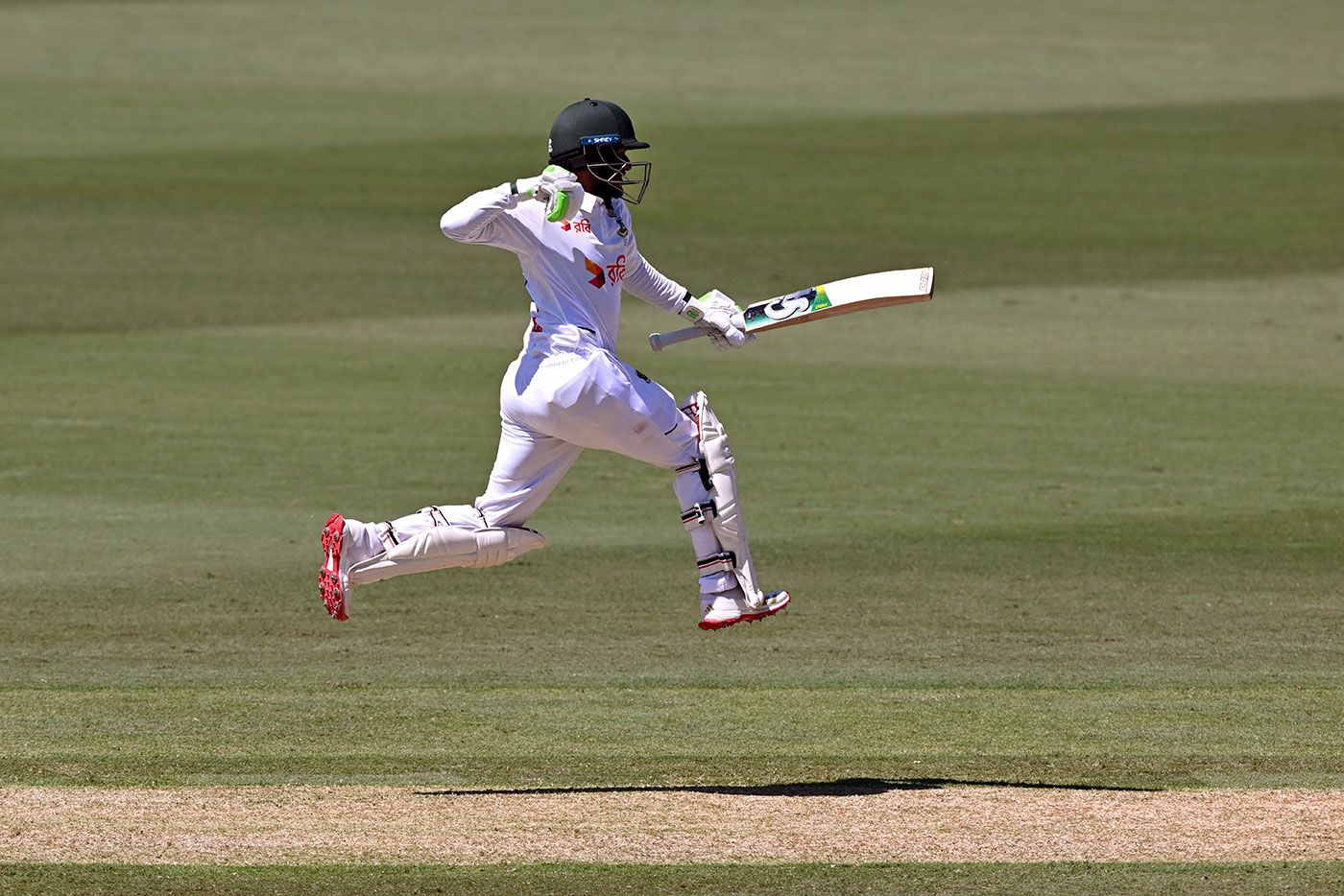 Tanzid Hasan leaps in celebration of his hundred