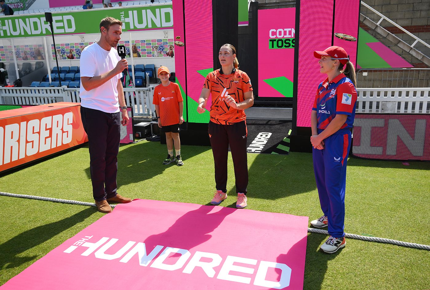 Stuart Broad, Dani Gibson and Sophie Molineux at the toss