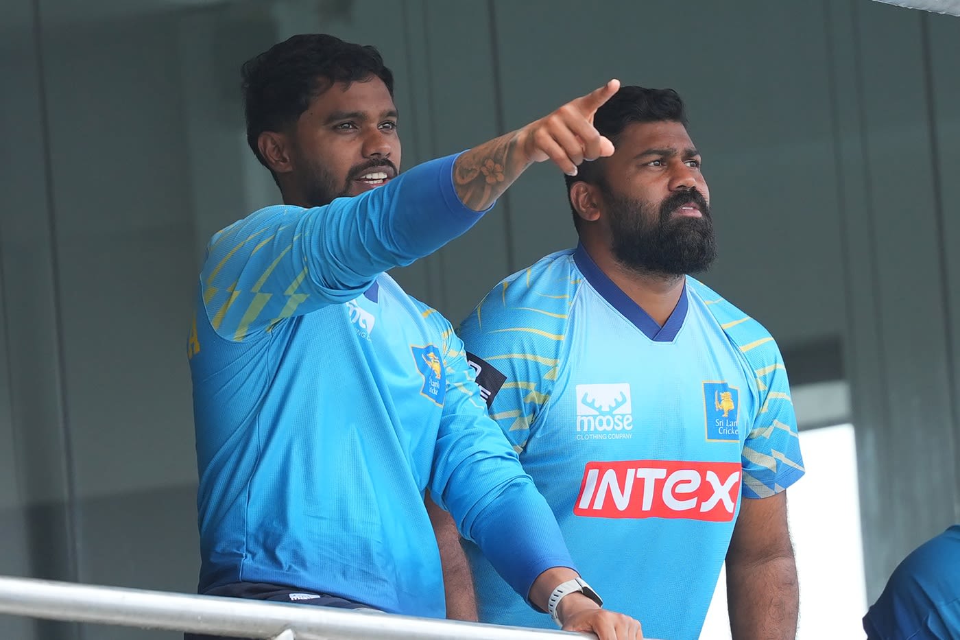 Dhananjaya de Silva and Lahiru Kumara wait for the play to restart after rain
