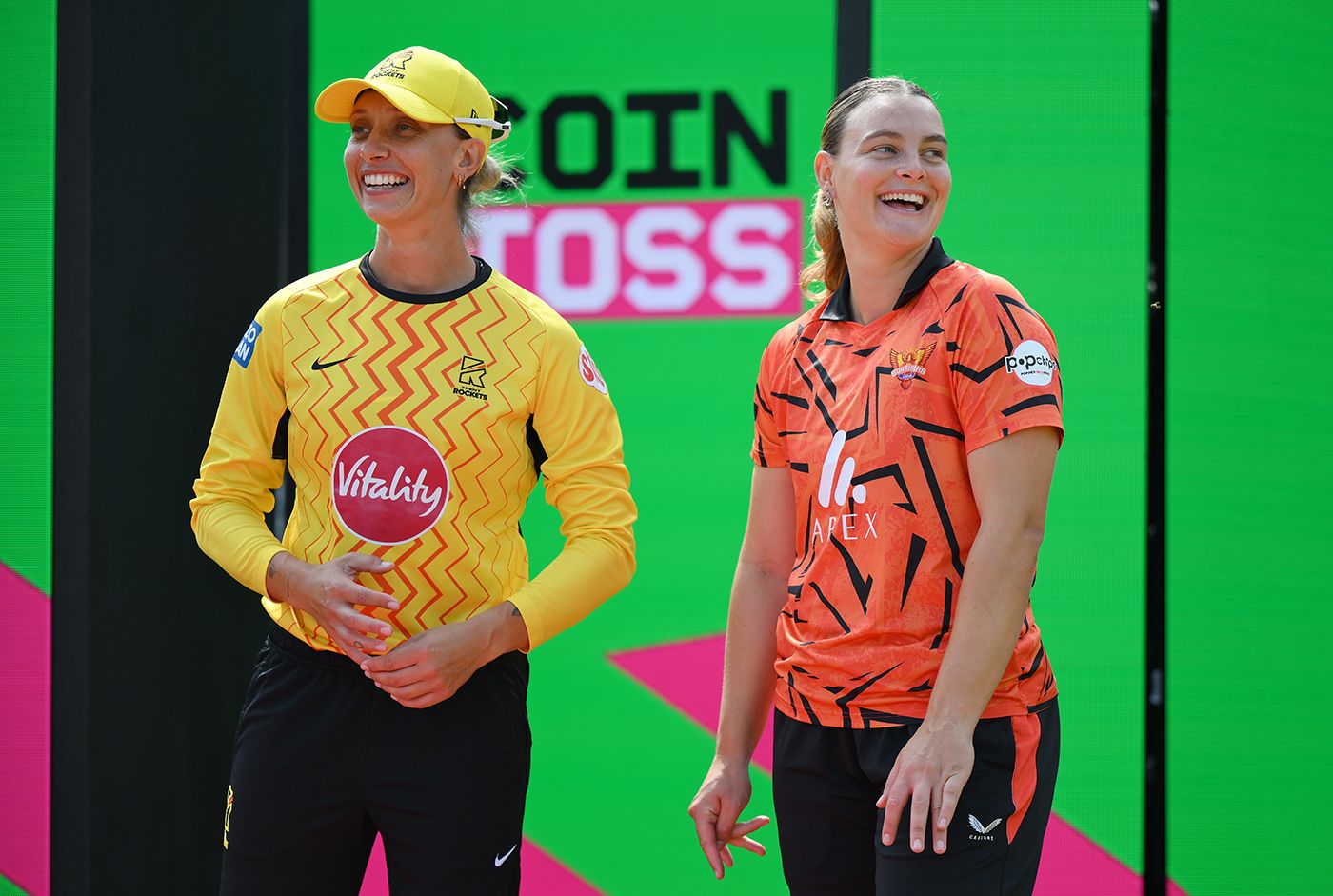Ash Gardner and Dani Gibson at the toss