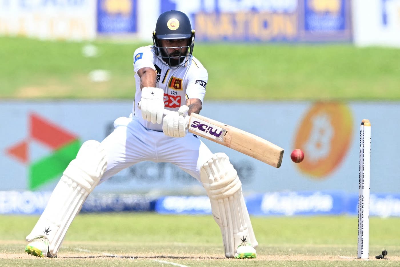 Niroshan Dickwella reaches out for a cut
