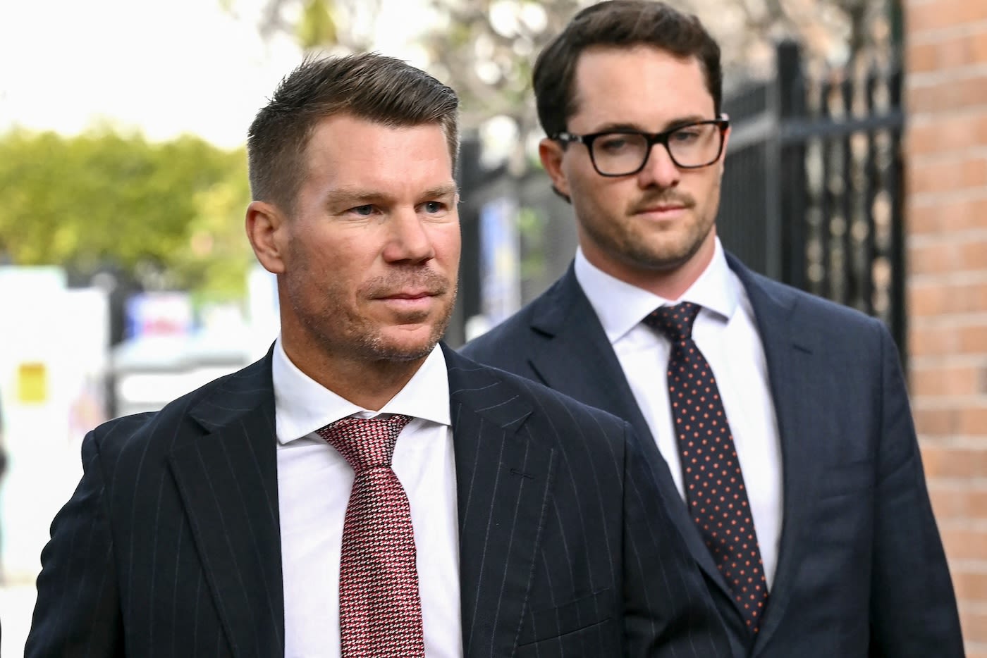 David Warner arrives at a court for a hearing