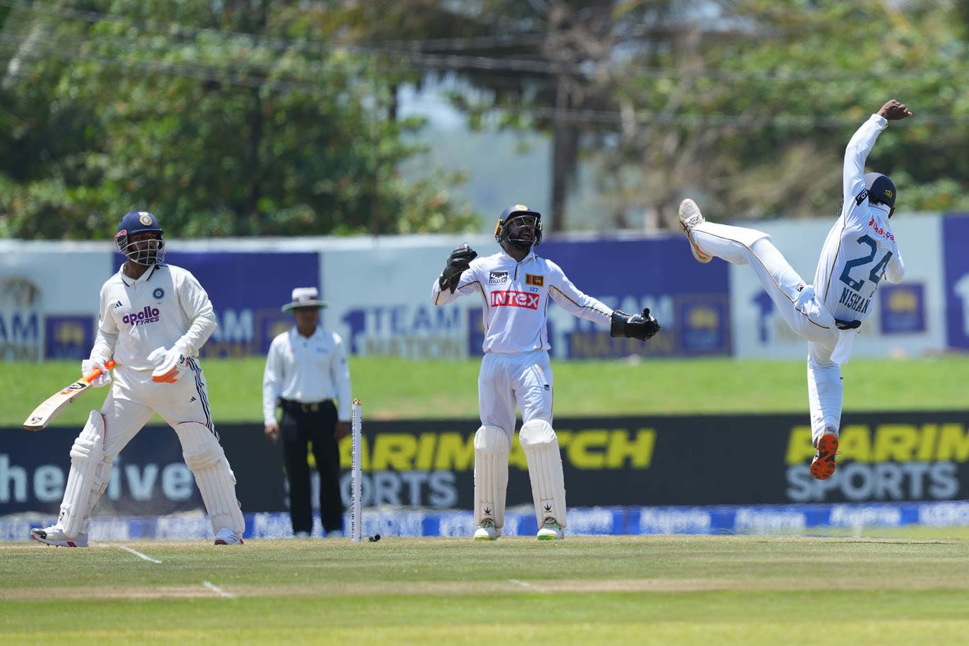 Nishan Fernando attempts an acrobatic stop