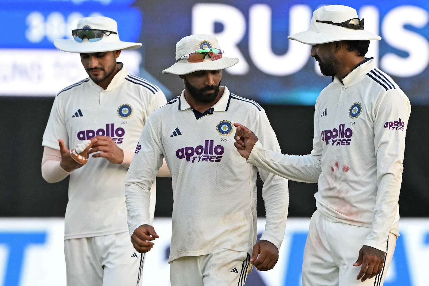 KL Rahul makes a point to Ravindra Jadeja as they walk back with Shubman Gill