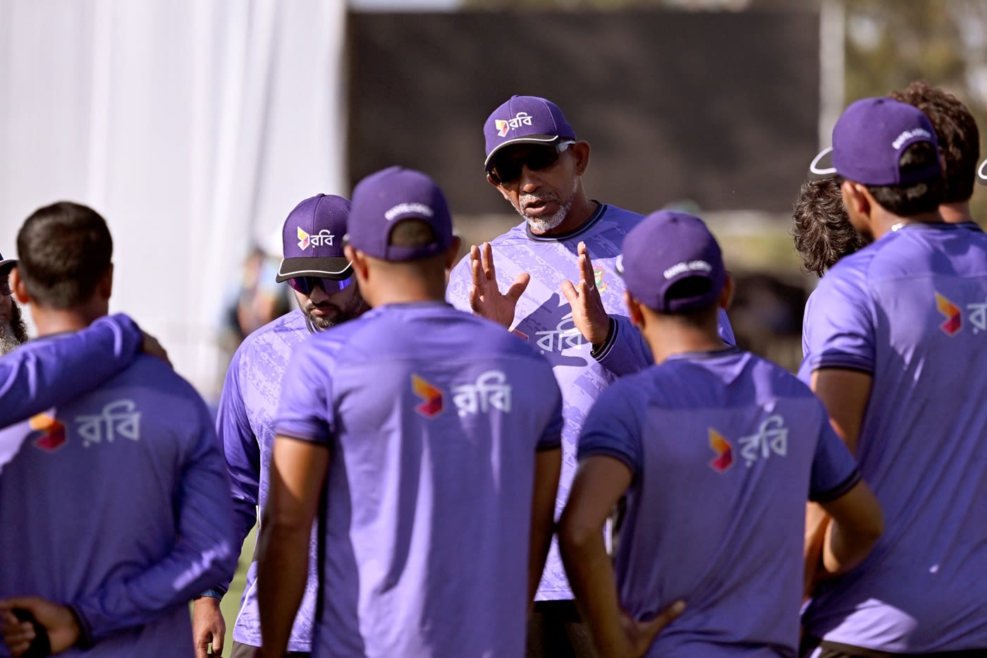 Phil Simmons speaks to his side before play