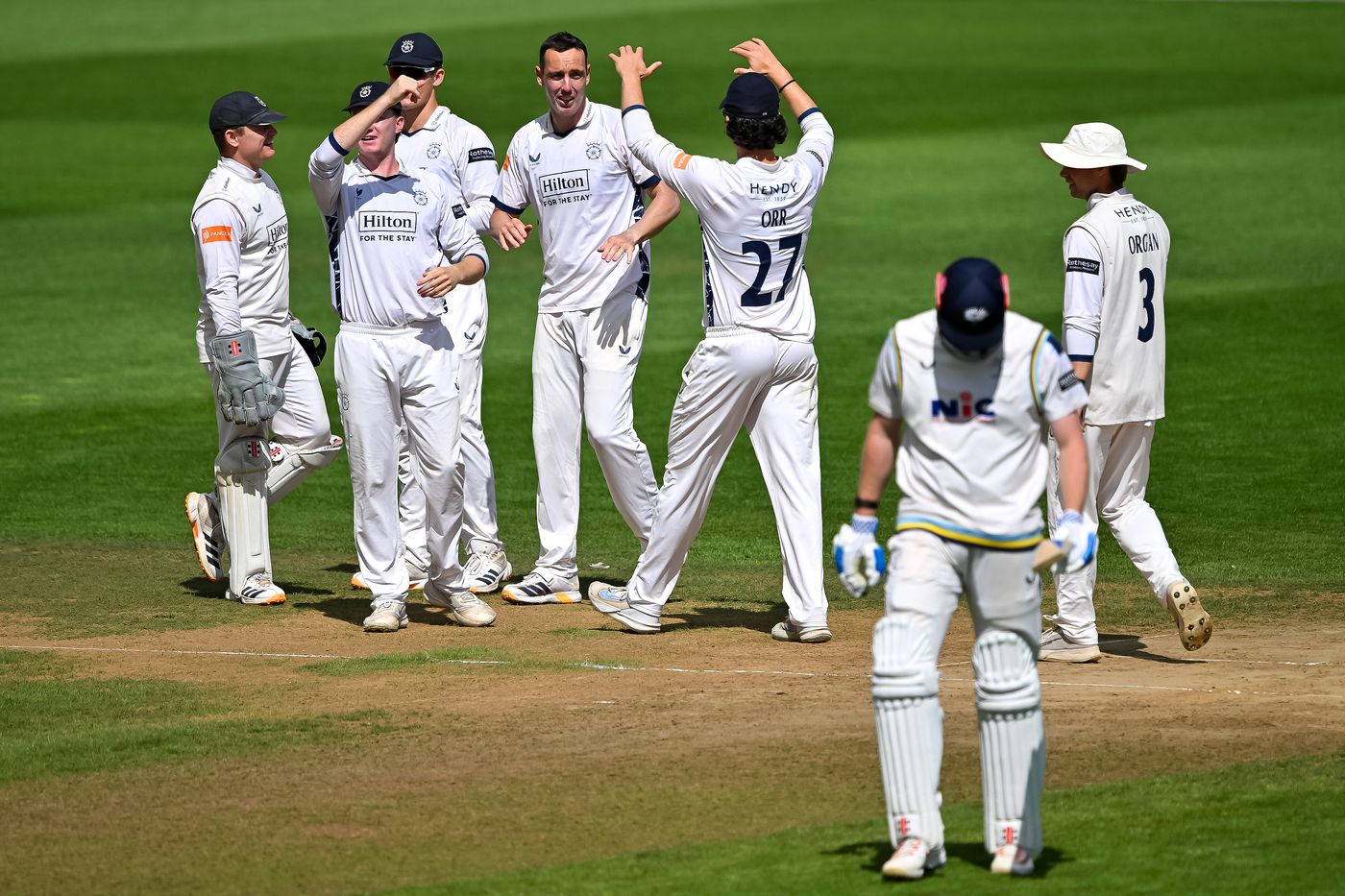 Kyle Abbott celebrates with his team-mates