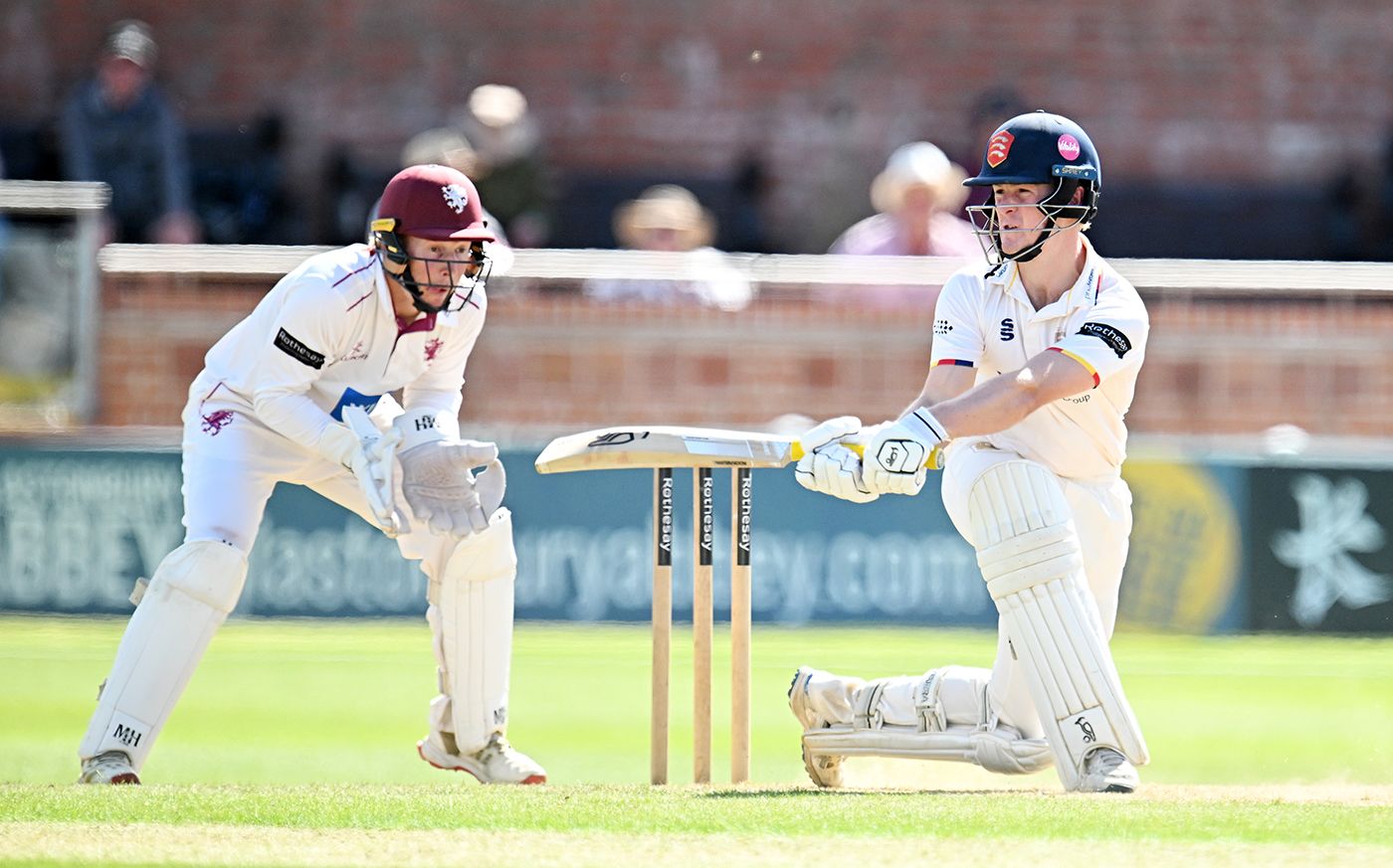 Charlie Allison reverse-sweeps during his century
