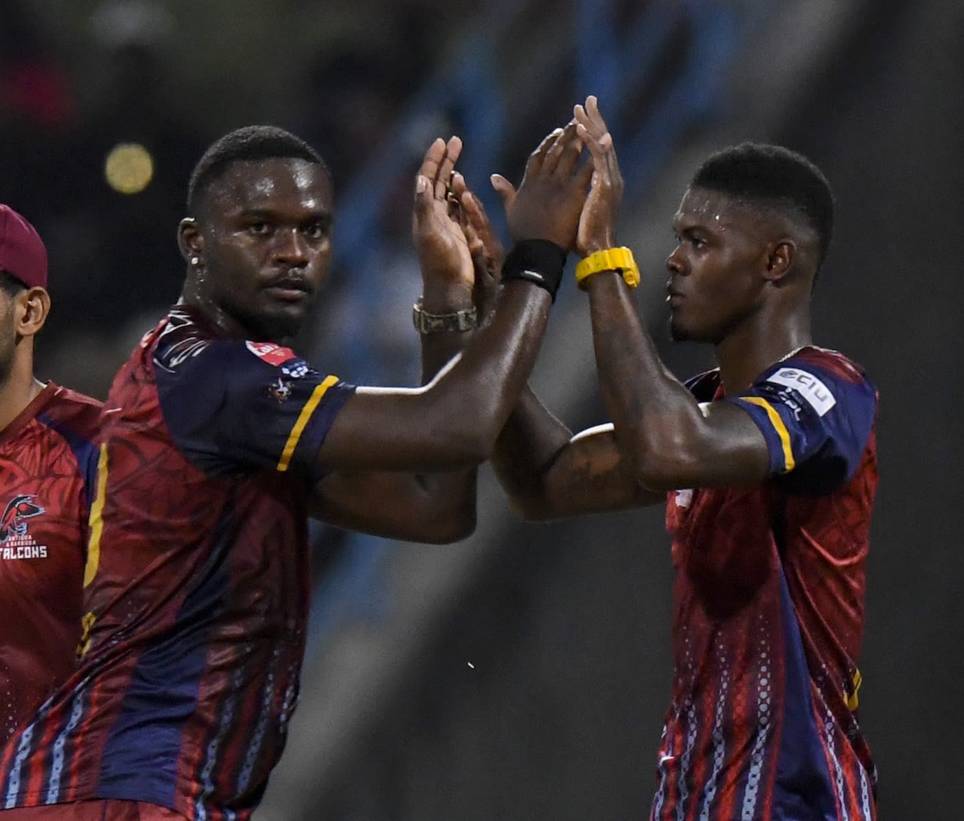 Jayden Seales and Alzarri Joseph celebrate a wicket