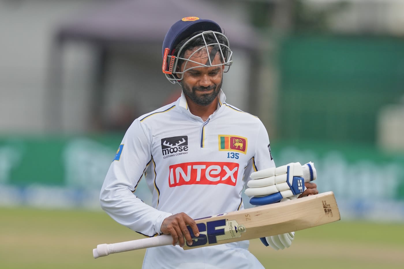 Dhananjaya de Silva walks back after an unusual dismissal