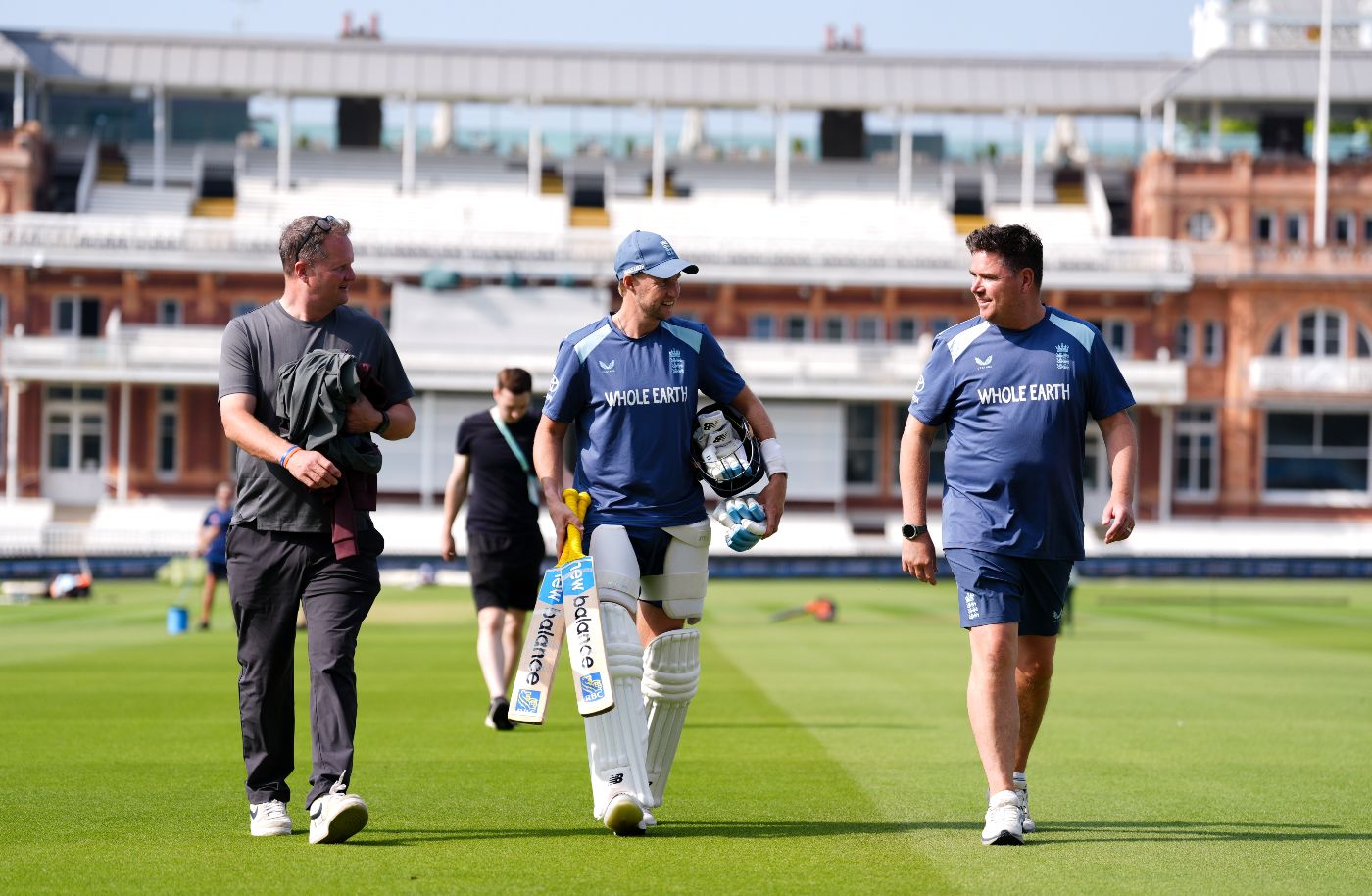 Joe Root chats with Rob Key and Marcus North on the outfield at Lord's
