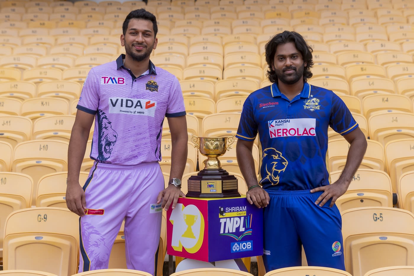 M Shahrukh Khan and B Anirudh pose with the TNPL trophy